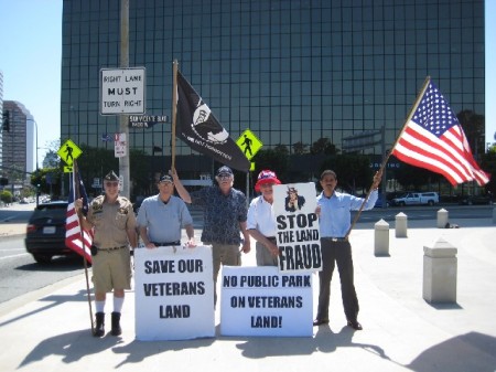 Terry Richards, Robert Rosebrock, et al Demonstrating with Veterans Homes Advocates during the Memorial Day Rally on Sunday May 29, 2012 just outside of Wilshire and San Vicente West Los Angeles VA Gate before I found out that 80% of homeless Veterans do not want to live in Veterans Homes on VA Property. They want to live in HUD-VA Section 8 Private Independent Housing… Looking at the photo I am second from the left and Robert Rosebrock who turned-out to be a very Demonic individual is third from the left next to me holding the black MIA Flag…
